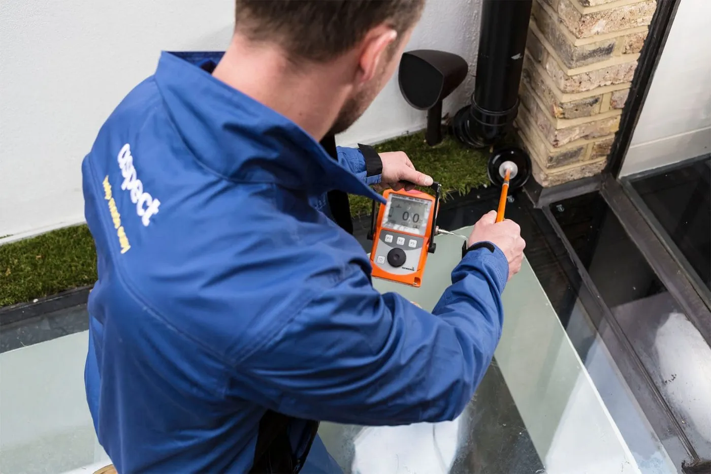 Leak detection engineer surveying a London property